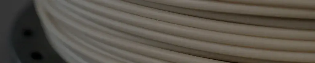 a roll of natural colored filament