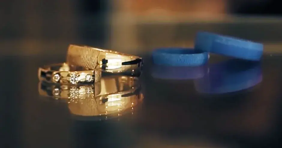 Gold ring next to 3D printed mold