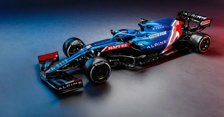 ショールームに展示された Alpine の F1 レーシングカー (赤、白、青のアンビエント照明)
